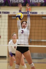 Senior Ava Cunningham (3) looks to block a shot against Mt. Whitney in Tuesday night volleyball action in the LHS Event Center.